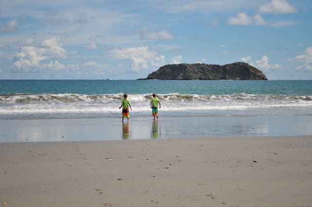 kids playing on the beach in manuel antonio